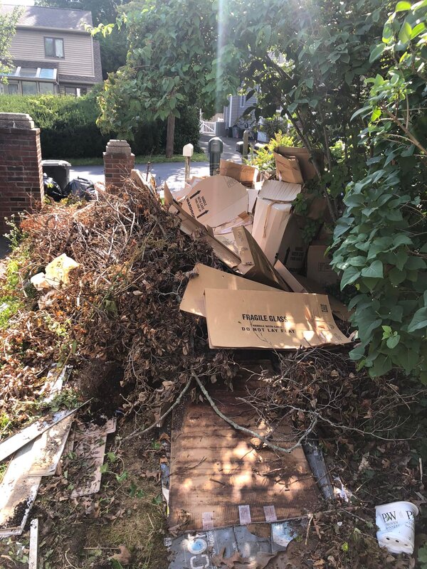 In this picture you can see the process of a property clean out in Suffolk County. There are still some cardboard boxes that need to be cleaned out. 